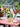 lego botanicals 40524 sunflowers191 piece set. shows the sunflowers and 2 other sold separately sets sitting in 3 vases, roses and tulips.