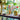 lego botanicals 40725 cherry blossoms 430 piece set. shows a range of the lego botanicals flowers in different vases.
