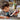 Young boy playing with the white and red jedi starfighter, a figure and lightsaber resting on the floor.