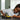 lego technic 42151 bugatti bolide. shows a young boy playing with the fully built car.