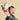 shows a child holding the lego space shuttle up to the camera.