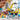 Lego City 60391 Construction trucks with wrecking ball 235 piece set. Shows a child playing with the fully built lego construction set, driving the digger toy.