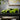 lego technic 42161 lamborghini huracan 806 piece set. shows a close up of the fully built neon green lamborghini huracan displayed on a shelf.