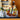 lego harry potter 76419 hogwarts castle and ground 2660 pieces. shows a close up of a section of the set, a ship on the water in front of the castle.