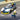Lego City 60415 Police Car & Muscle Car Chase. Shows a close up of the police car and officer minifigure with handcuffs.