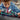 Lego City 60406 Race Car and Truck. Shows a close up of the race car being loaded onto the truck with the truck driver and race car driver minifigures in front.