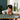 Lego Minecraft 21256 The Frog House. Shows a young boy playing with the fully built minecraft set.