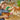 lego creator 31150 wild safari animals. shows a young girl playing with the fully built tree, giraffe and flamingo.