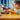 Lego Speed Champions 76922 BMW M4 & BMW Hybrid V8. Shows a young girl playing with the 2 fully built BMW Lego models.