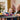 Lego Gabby's Dollhouse 10797 Gabby's Party Room. Shows a father and daughter playing with the fully built set.