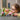 Lego Minecraft 21260 Cherry Blossom Garden. Shows a young girl playing with the fully built lego set.