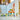 Lego Friends 42625 Beach Smoothie Stand. Shows a close up of the fully built beach smoothie stand, mini figures, car, surfboard and accessories.