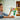 Lego Botanicals 10347 Petite Sunny Bouquet 373 piece set. Shows a young girl playing with the flowers as they sit arranged in a bouquet in a vase.