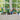 lego botanicals 40524 sunflowers 191 piece set. shows a wide range of the lego botanical sets, each in a vase displayed on a windowsill.