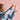 shows a child holding the lego unicorn in their hand as it is on it's 2 back legs.